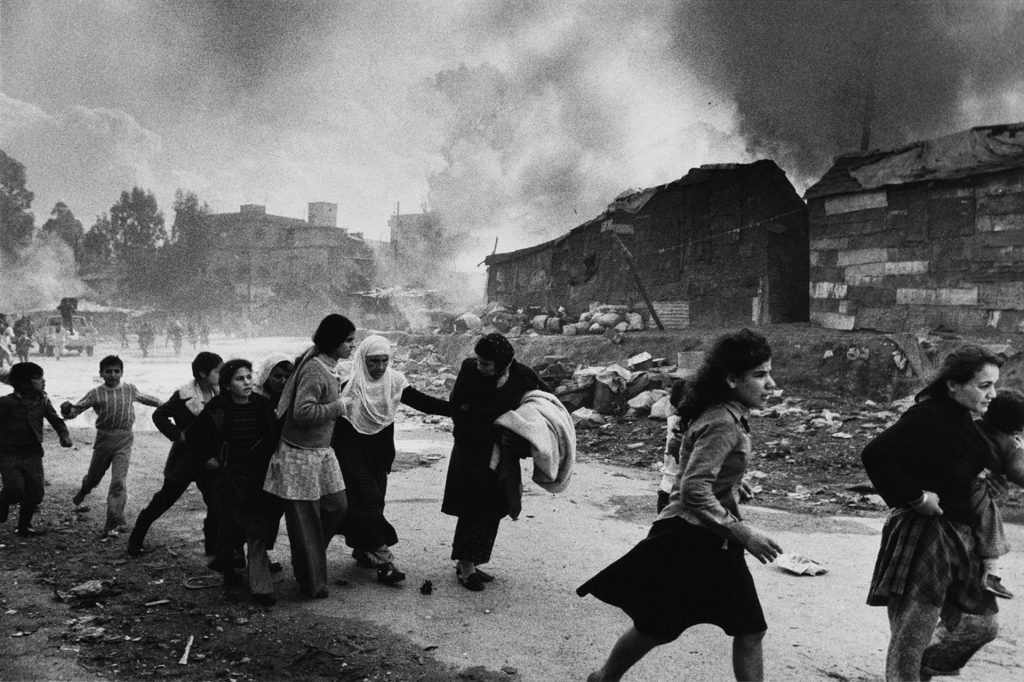 Palestinians flee attack. Up to 1,500 Palestinians died in the Karantina massacre by Christian Falangist gunmen. Beirut, Lebanon 1976. Don McCullin